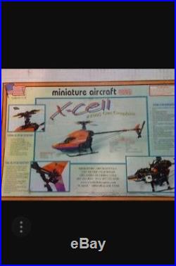 2 Xcell helicopters (New)gasser 1005 &futaba servos zenoha kalt G23&used muffler